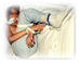 A person lying on a bed
Description generated with very high confidence