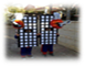 A group of people on a sidewalk
Description generated with high confidence