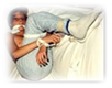 A person lying on a bed
Description generated with very high confidence